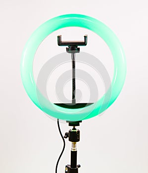 Round lamp with a smartphone holder.