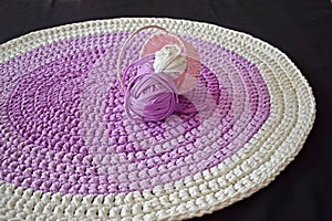 Round lilac handmade rug.