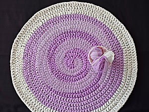 Round lilac handmade rug.