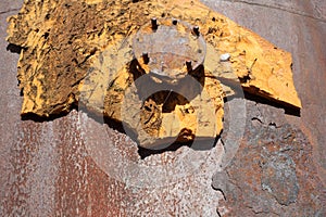 Round metal cover with bolts. Heavy hatch , rusty, and with traces of polyurethane sealant.