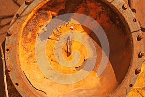 Round metal cover with bolts. Heavy hatch , rusty, and with traces of polyurethane sealant.