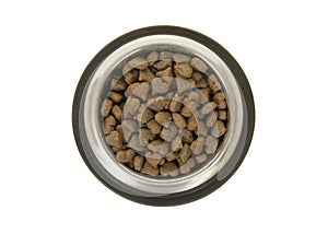 Round metal feeding bowl with heart shaped pet kibble seen from