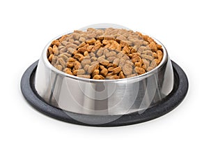 Round metal stainless steel bowl with dried food for pets, animals isolated on white background