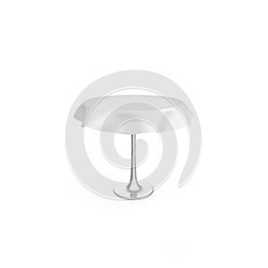 Round metal table with white tablecloth. There is room for Your design. Isolated white background