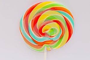 round multi-colored candy lollipop close-up