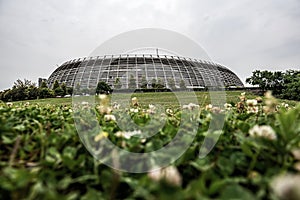 Round office building on the grass.