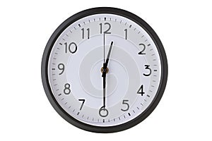 Round office wall clock on white, half past twelve