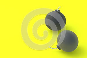 Round old bombs with fuze on yellow background. Copy space