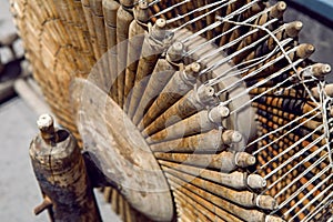 Round old wooden spinning wheel for wool