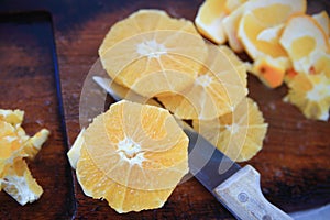 Round orange sections on cutting board