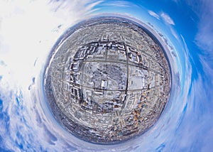 Round panorama aerial view of city sunny day, the winter landscape of the snowy town, blue sky with white clouds above the park,