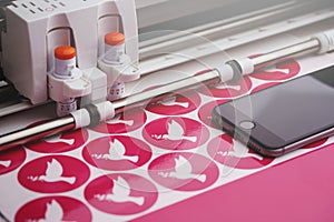 round peace dove stickers are made by a computerized cutting machine from pink adhesive film