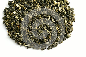 Round pile of dry tea. Chinese green tea with Jasmine flavor. Tea for weight loss and elimination of toxins