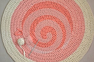 Round pink handmade rug.