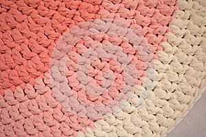 Round pink handmade rug.