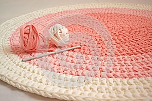 Round pink handmade rug.