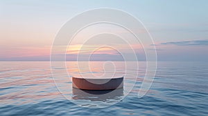 Round platform floating on calm sea at sunset