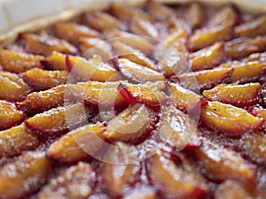 Round plum cake with cinnamon. Concept of seasonal pies, cakes and desserts