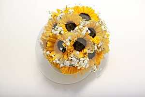Round posy of colorful yellow sunflowers