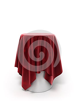 Round red velor cloth on a round pedestal isolated on white
