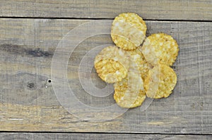 Round rice cakes on wooden background