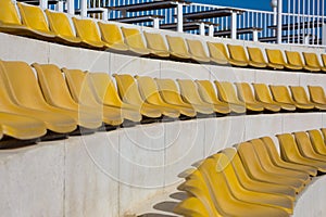 Round rows with yellow empty seats