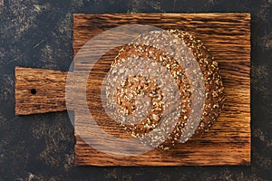 Round rye bread sprinkled with sunflower seeds.