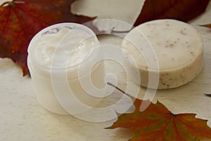 Scrub soap and a facial mask with maple leaves