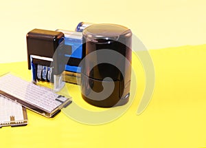 Round seal and stamps for documents on a light background.