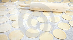 Round shape of the dough and rolling pin