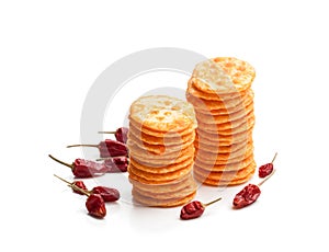 Round shape rice cracker with chili pepper isolated on white