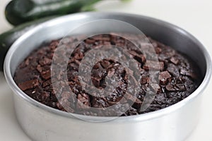 Round shape Zucchini chocolate cake inside the cake pan