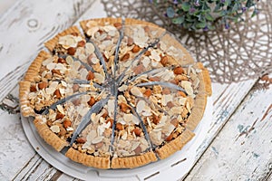 round of slice cheese pie on a white desk