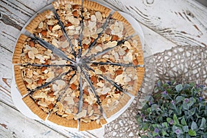 round of slice cheese pie on a white desk