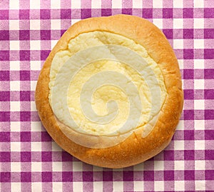 Round sour cream dessert bun photo