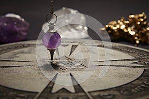 Round spiritual chart carved to wood used for communication with pendulum