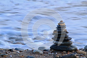 Round stacked stones on the shore