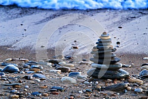 Round stacked stones on the shore