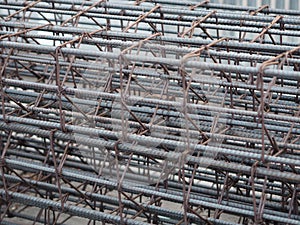 Round steel stacks are tied with Spirals steels sheath to make the concrete column for building construction