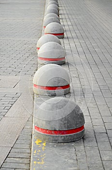 Round stone road kerb.