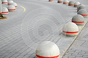 Round stone road kerb.