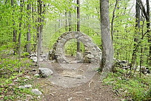 Round stone structure in the woods