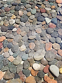 Round stones on fountain with clear water