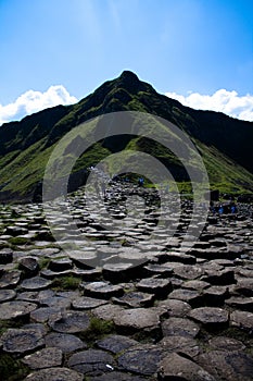 Round stones and green hill