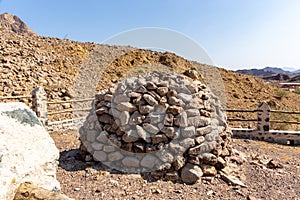 Round stony shelter on the hill in Hajar Mountains, Hatta, United Arab Emirates