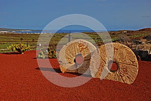 Round structure on red soil, view outside of Jardin de Cactus garden, last work CÃ©sar Cesar Manrique performed in Lanzarote Spain