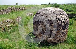 Round stupa and ancient streets at Sirkap, Taxila, Pakistan