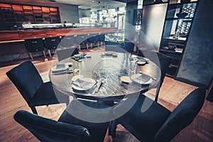The round table and the chairs. Restaurant decor.