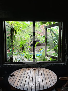 Round table by the window in a coffee shop