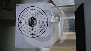 Round target with marked bulls-eye for shooting practice and shots